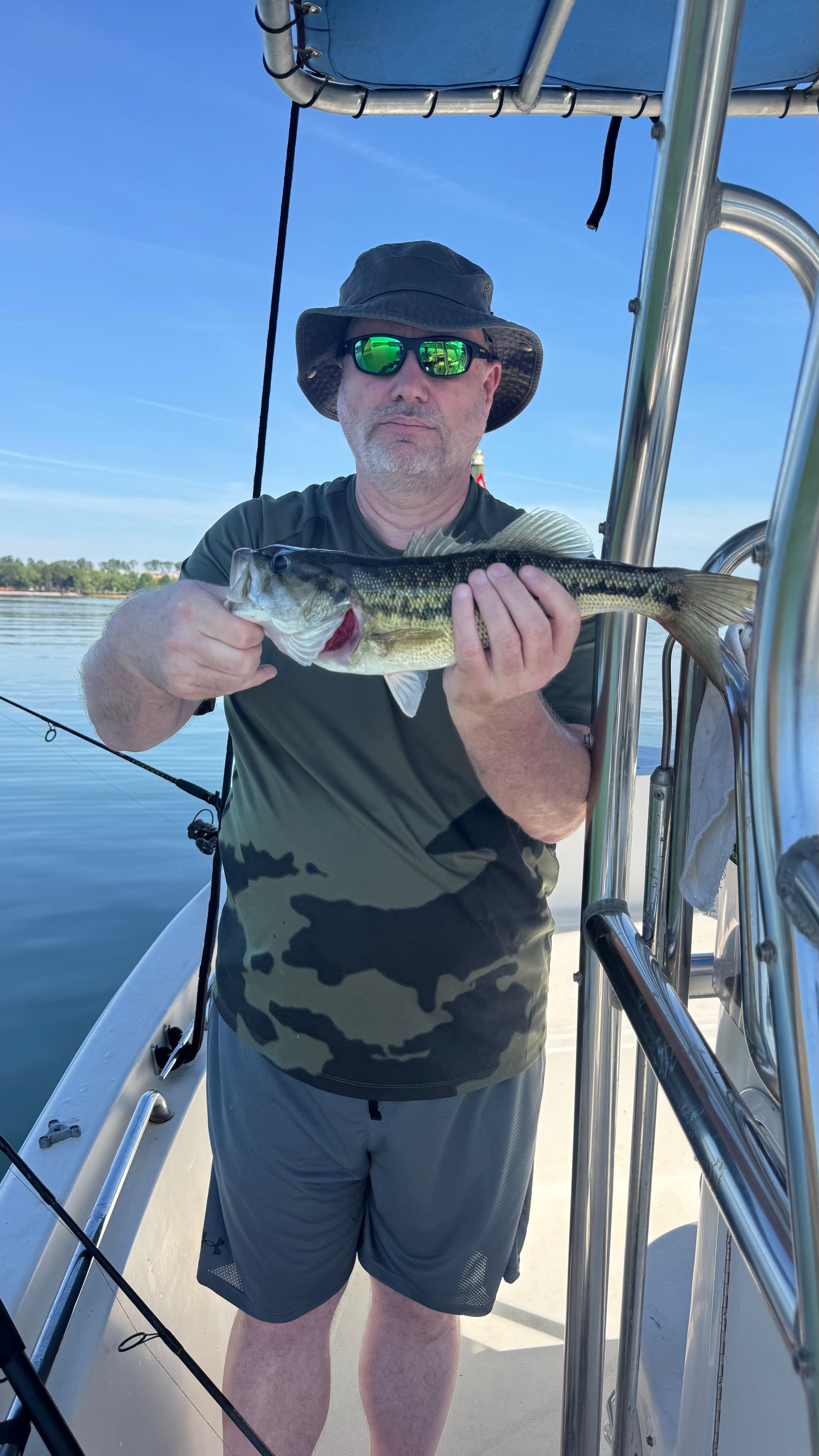 Spotted bass catch on fishing boat in Denver NC waters