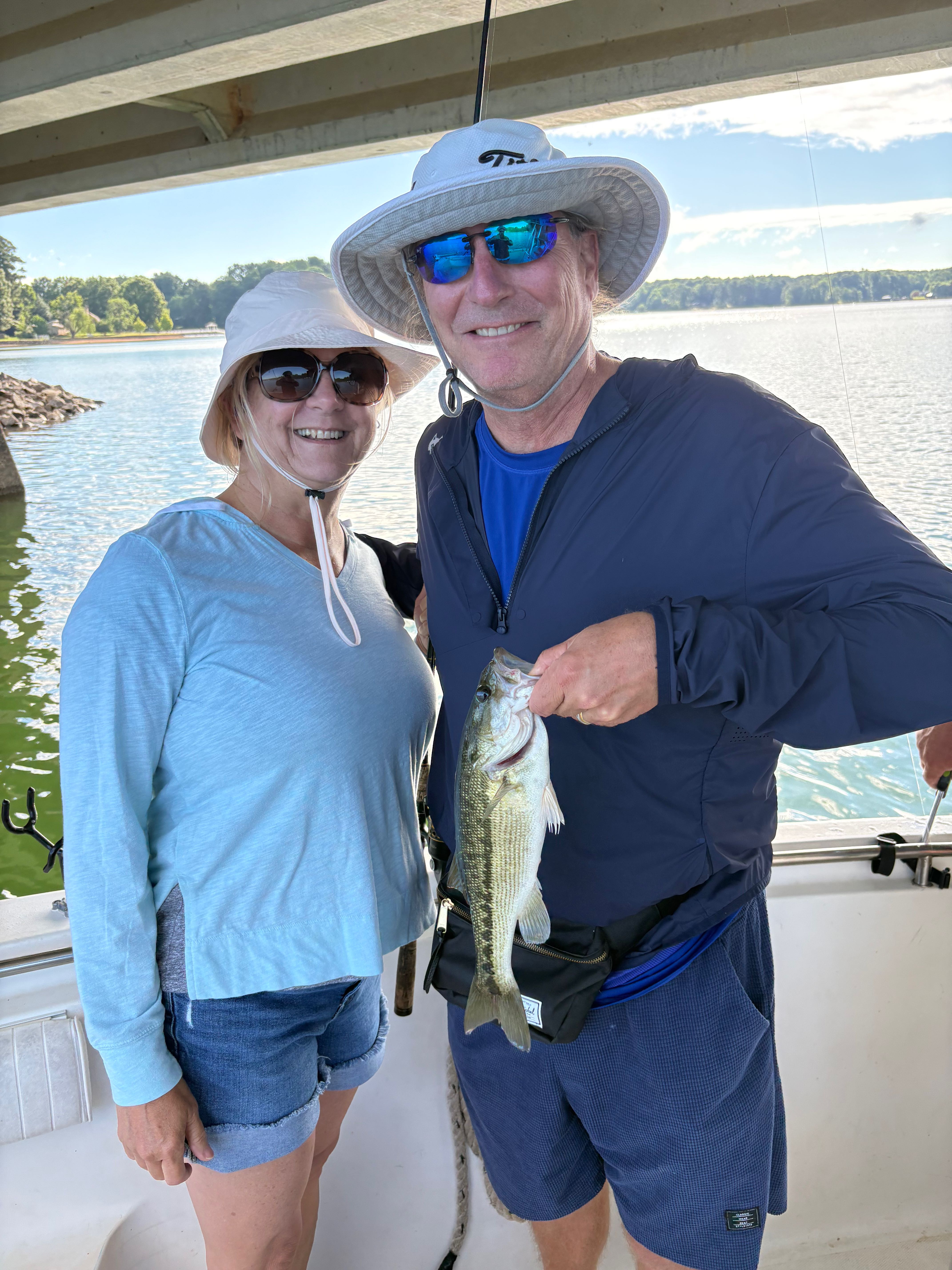 Successful spotted bass fishing trip on lake near Denver NC showing fresh catch
