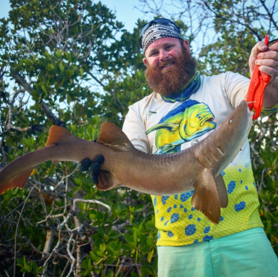 A person fishing with a rod in Florida