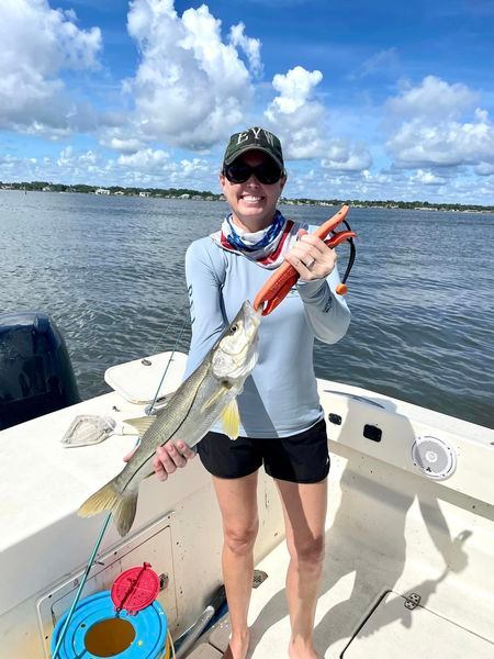 Successful angler with a 19-inch fish in FL