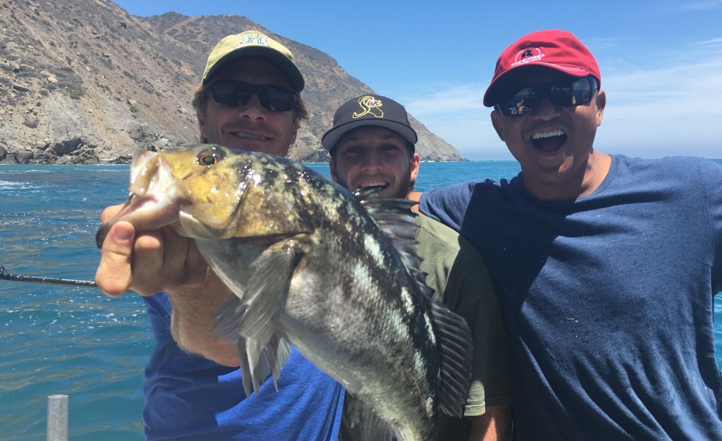 A group of 3 people fishing in California