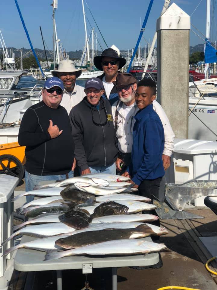 A group of 6 people fishing in CA