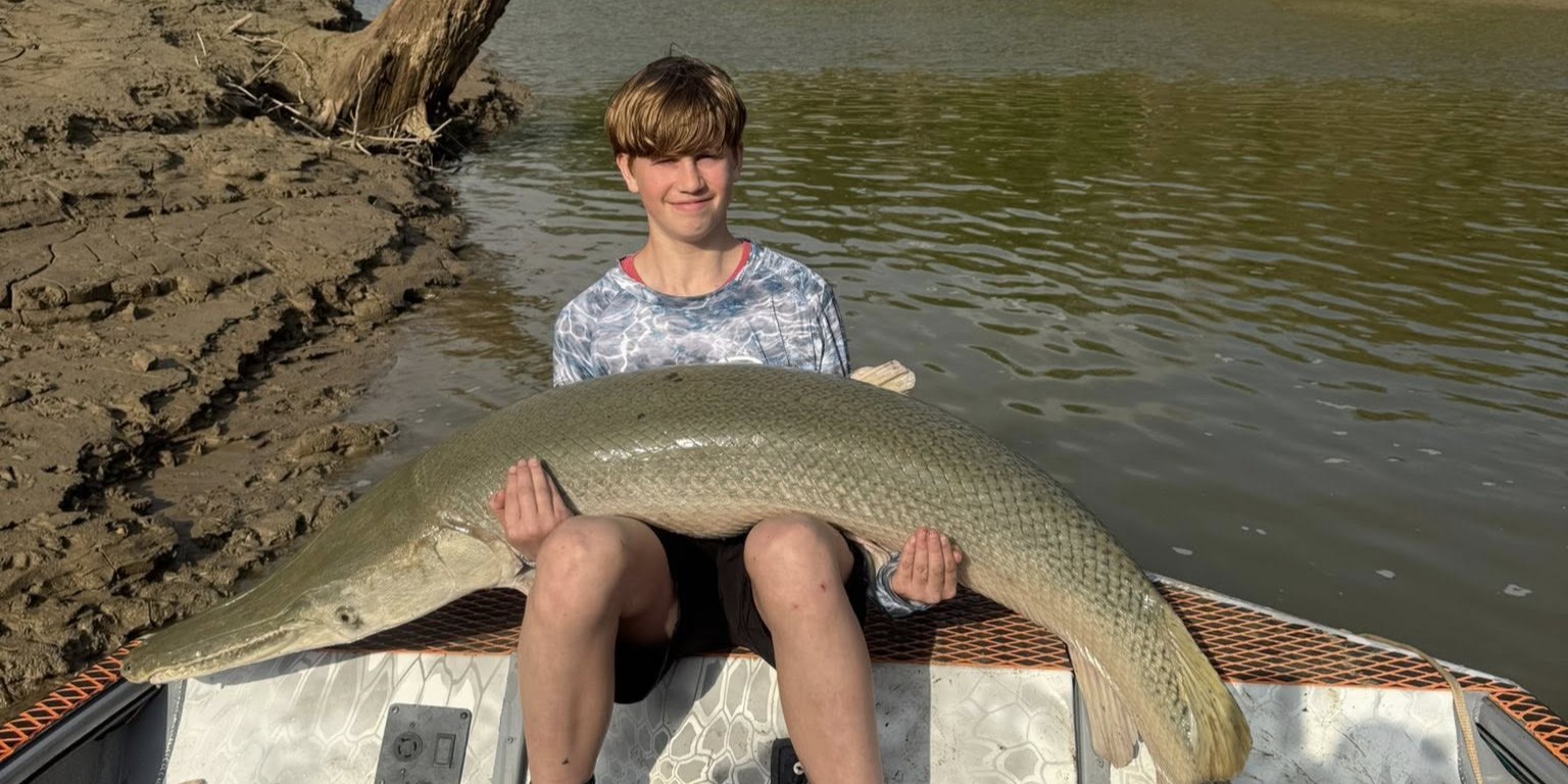 Alligator gar fishing boat on Trinity River near Palestine Texas with fishing guide and gear