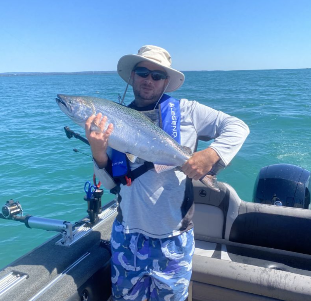 A person fishing on the water in ON