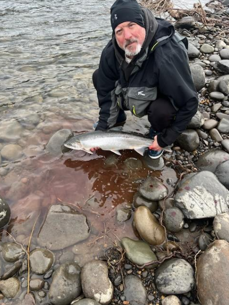 Fresh caught fish on rocky shoreline in Clackamas OR