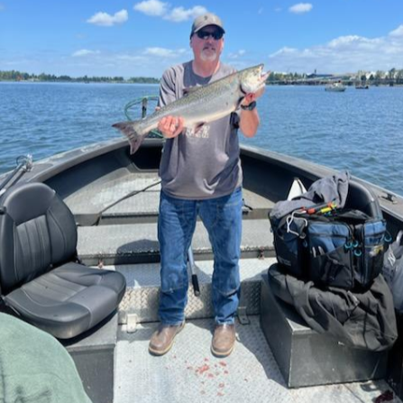 Oregon fishing charter boat Willy Predator on river with guide and anglers fishing for salmon