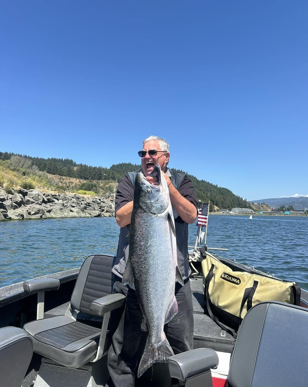 Large Chinook salmon catch displayed on fishing boat in Gold Beach Oregon