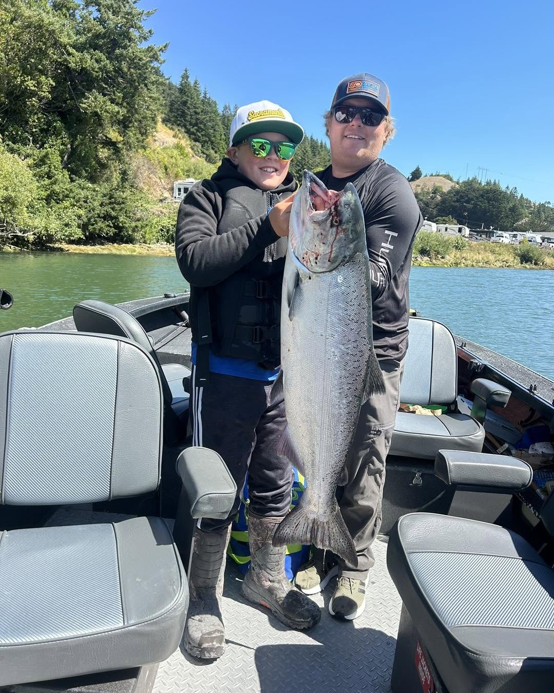 Large Chinook salmon caught fishing in Gold Beach Oregon displayed on boat