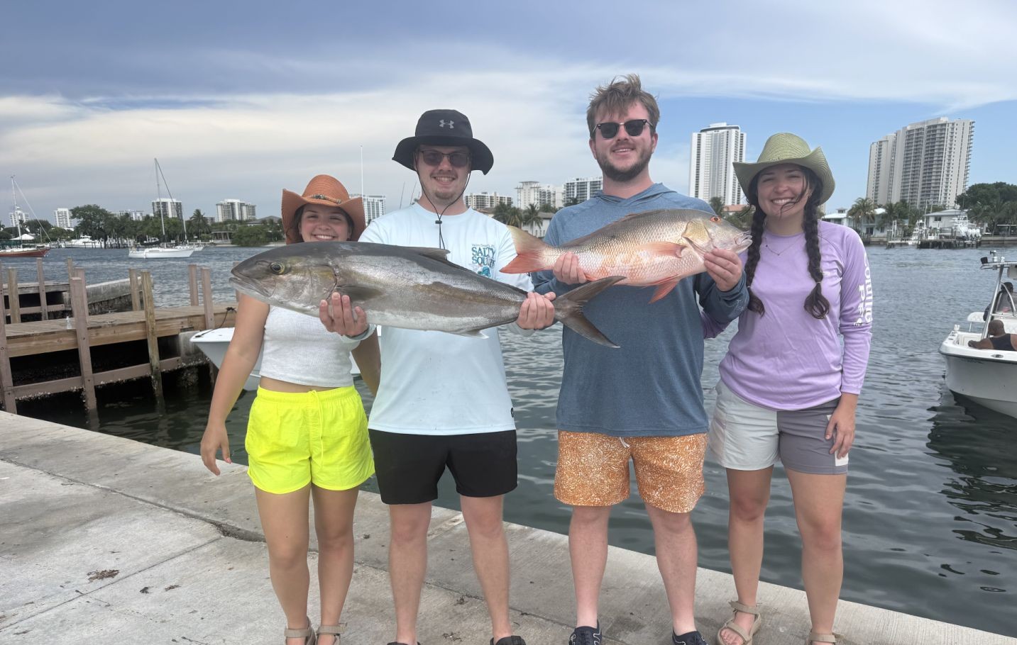 Two large longfin yellowtail and mutton snapper fish caught while fishing in West Palm Beach
