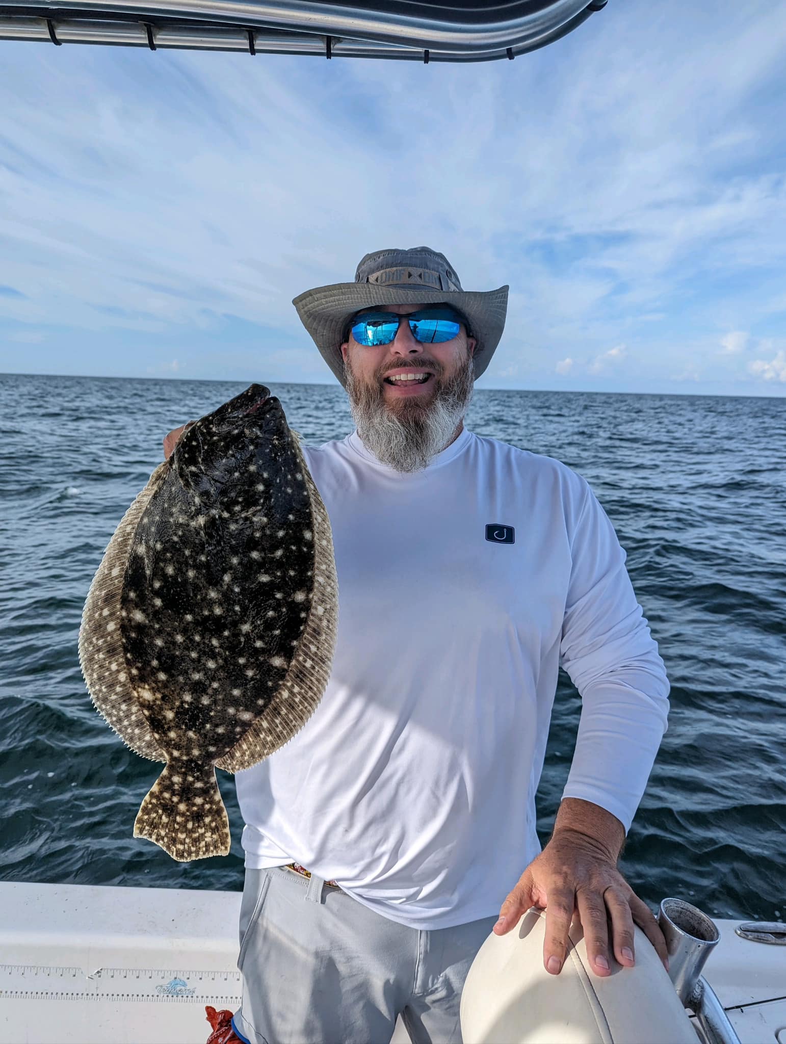 Angler with a 16-inch Summer Flounder in FL