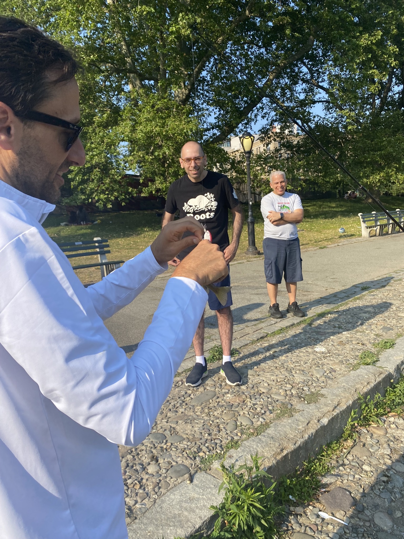 Three people fishing in Manhattan