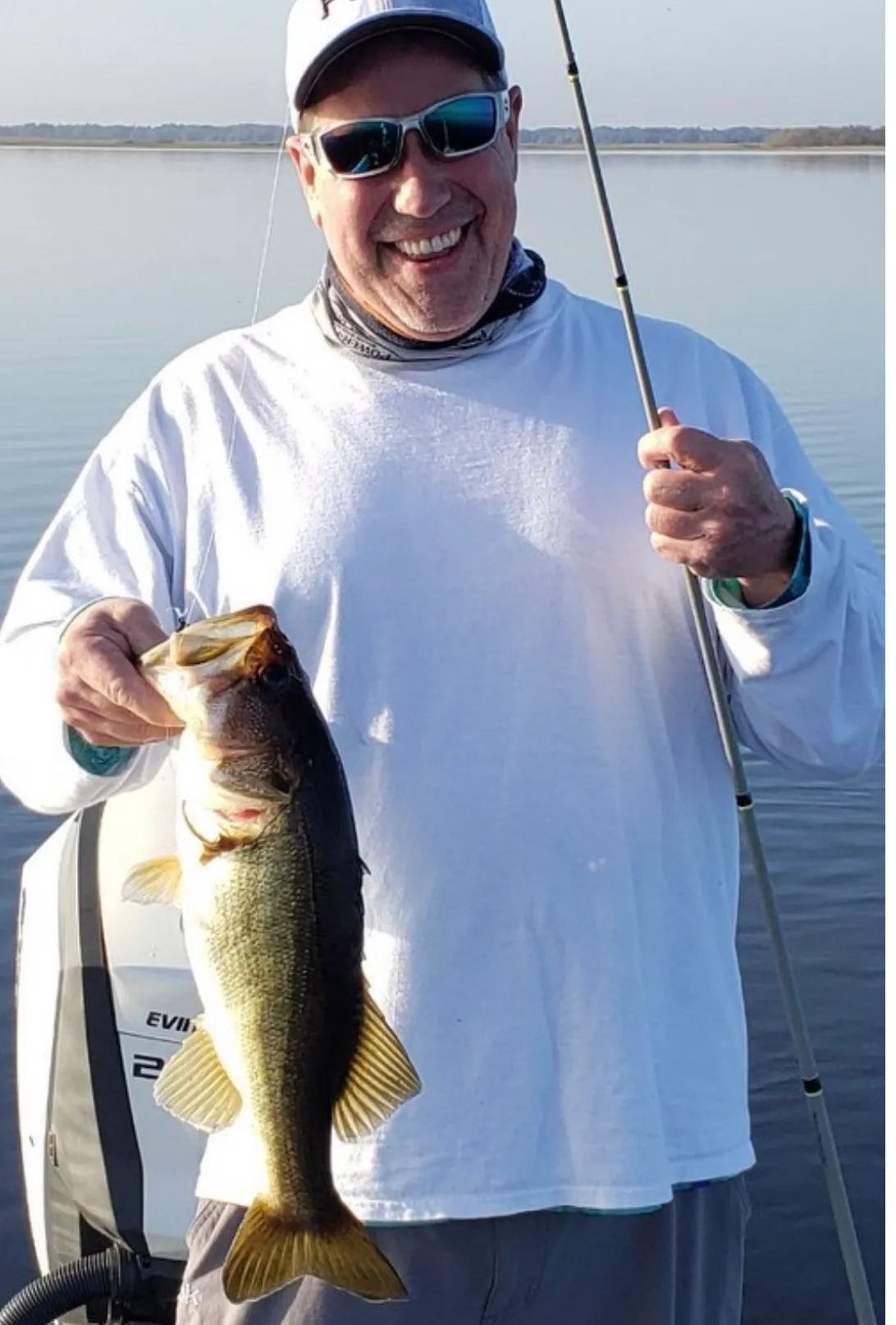 Two anglers holding fishing rods in Hartwell