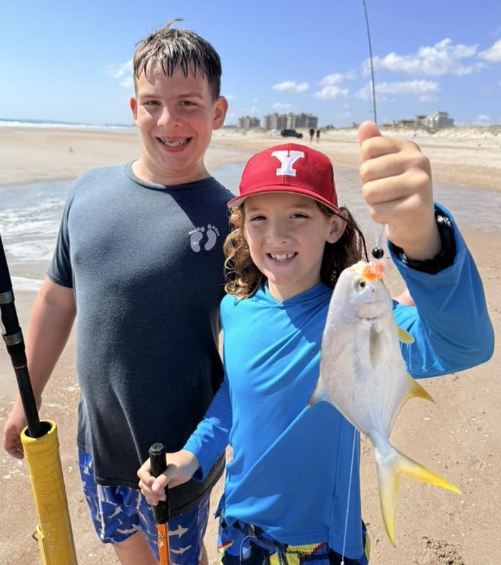 Kids surf fishing with Captain Brandon on Fernandina Beach, Florida - family shore fishing trip