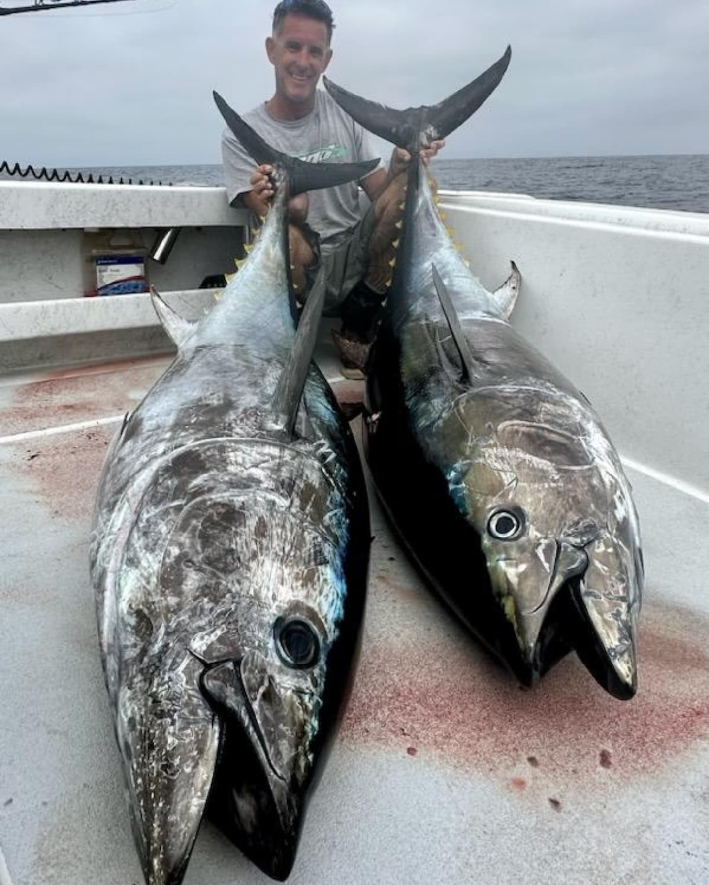 Two large bluefin tuna caught fishing in Collinsville TX displayed on boat deck