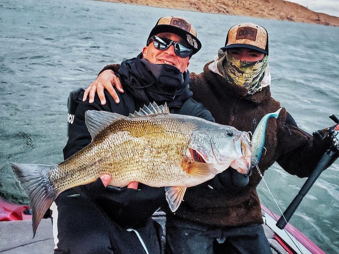 Harbor fishing boat with anglers targeting bass and halibut on 8-hour guided trip