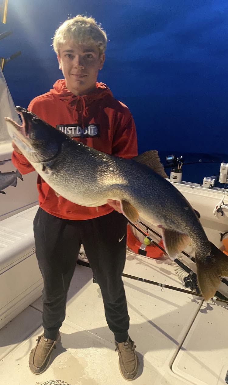 Lake trout caught while fishing in Sheboygan WI displayed on boat deck