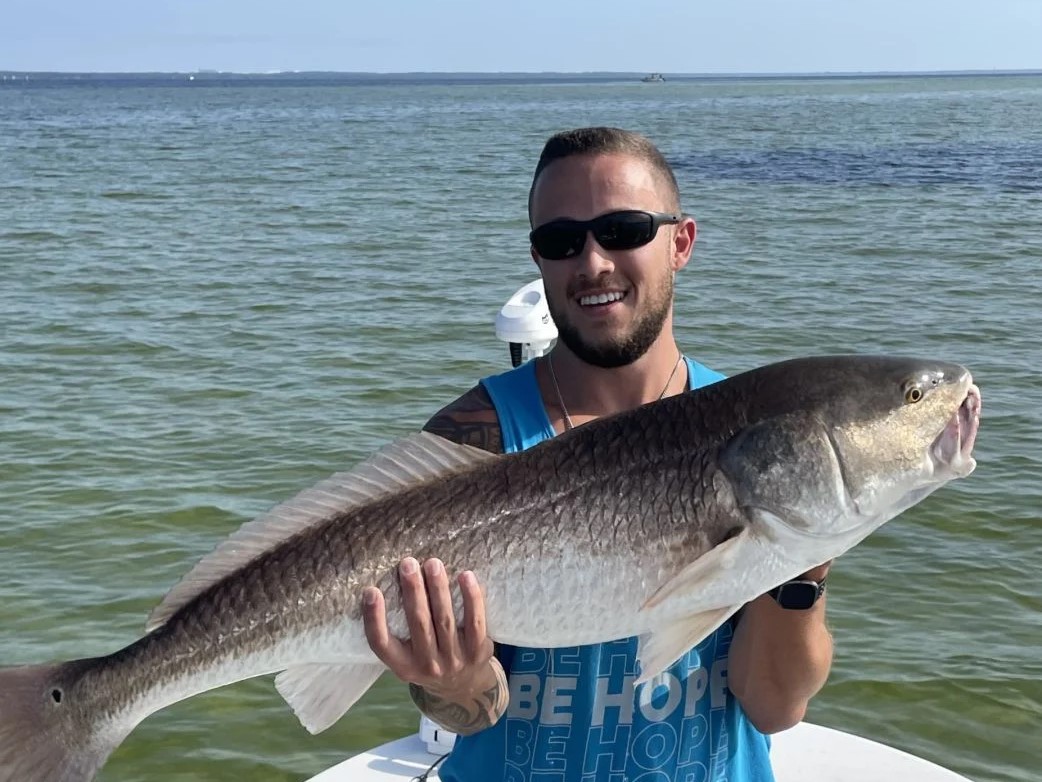 Fisherman catches big redfish in Fort Walton Beach