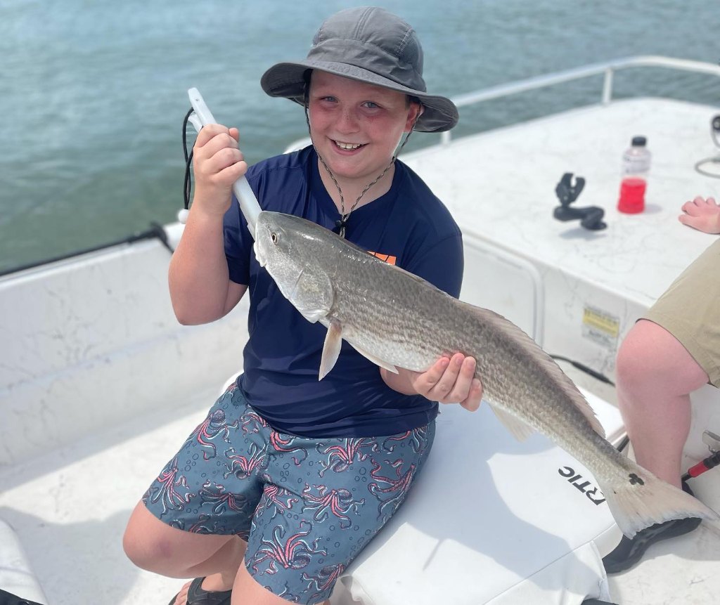 Fisherman with big 21-inch catch at Wrightsville Beach