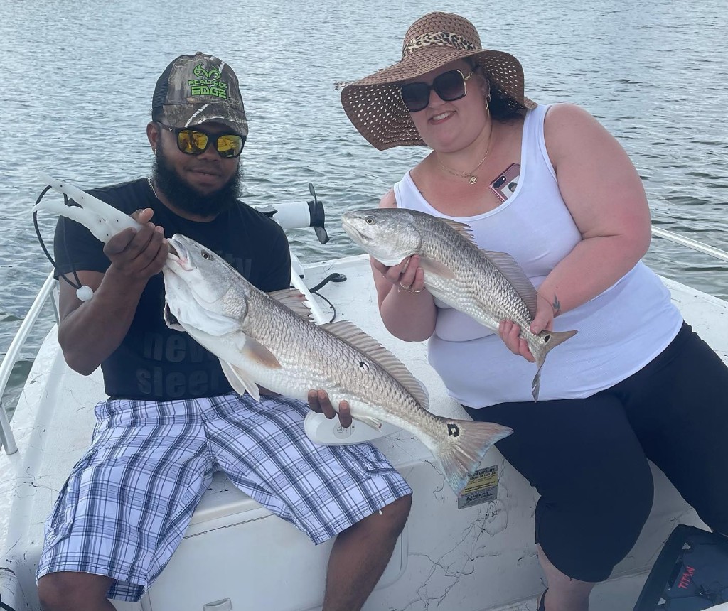 Two redfish measuring 19 inches, caught at Wrightsville Beach