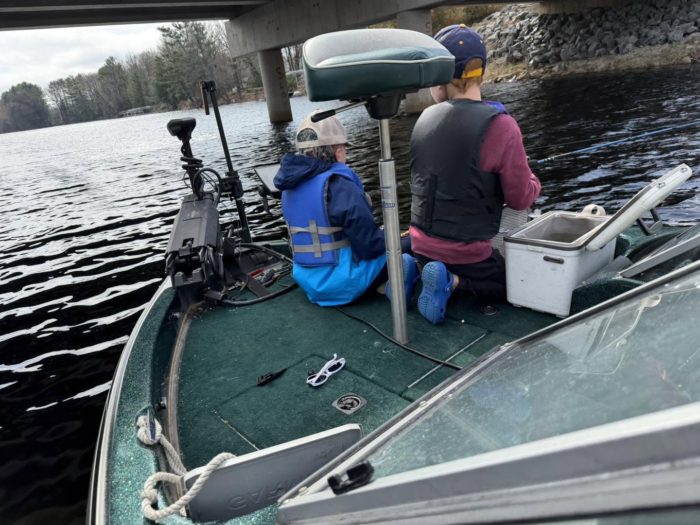 Fishing boat with equipment on water near bridge in Fort Atkinson WI