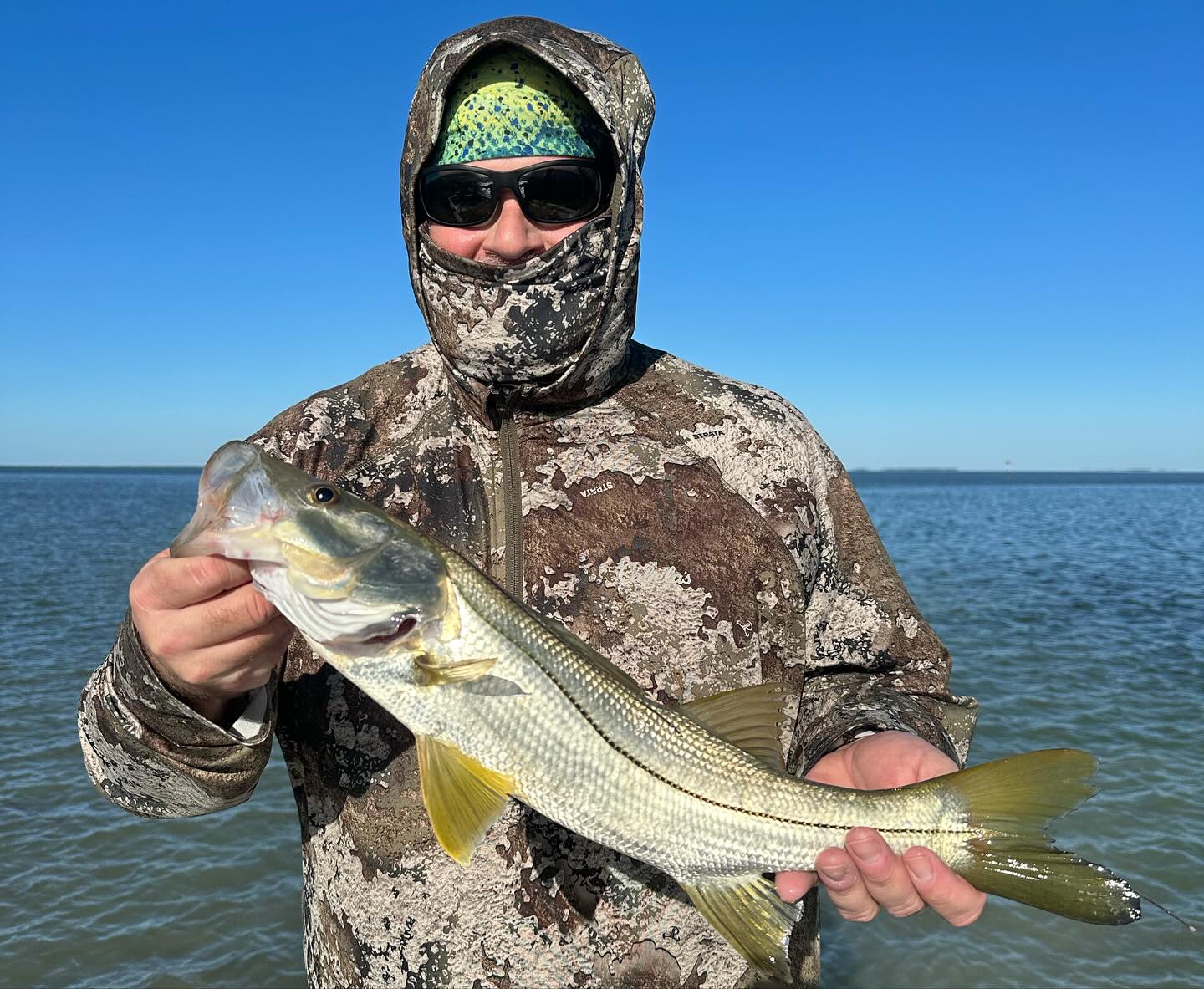 Angler with 23-inch snook fish caught in FL