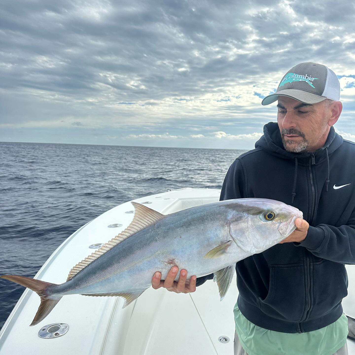 Catching a huge greater amberjack while fishing in Miami