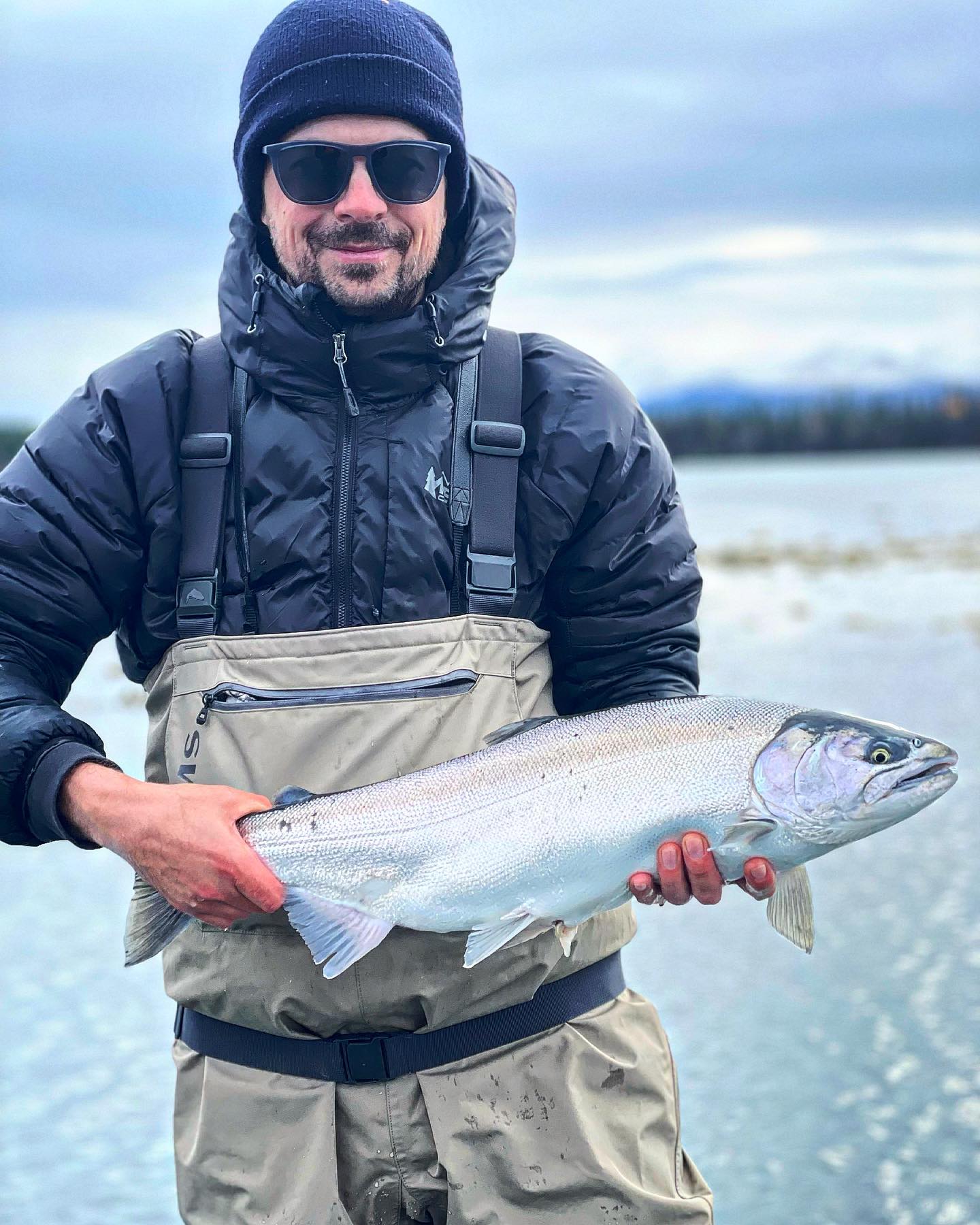 Angler catching a fish in Alaska