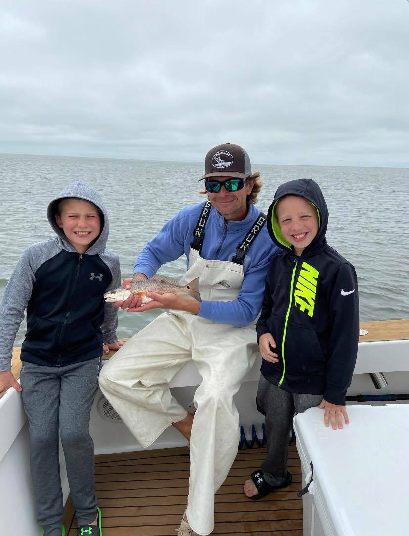 A group of 3 people fishing in North Carolina