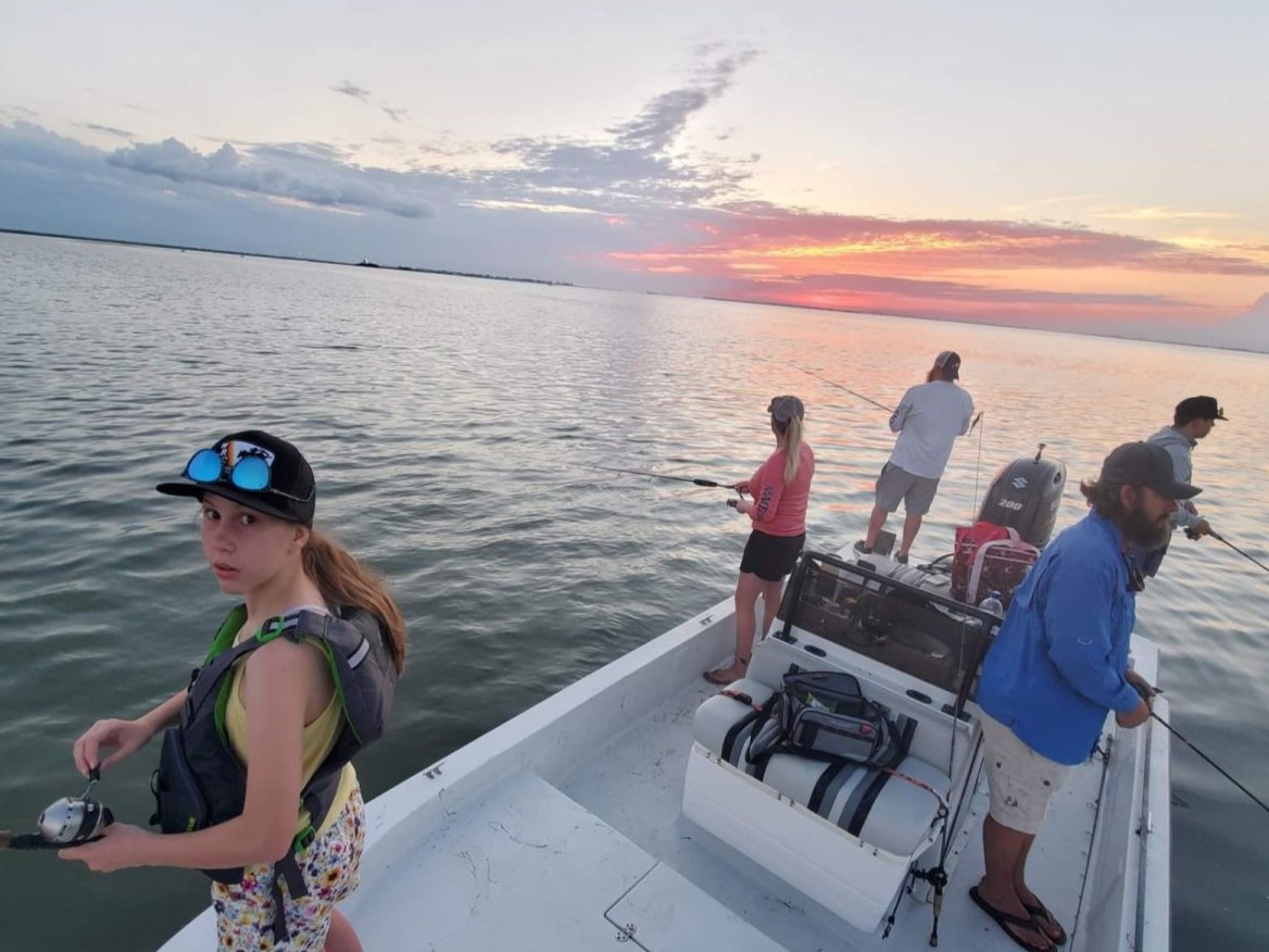 Three people enjoying fishing in Rockport