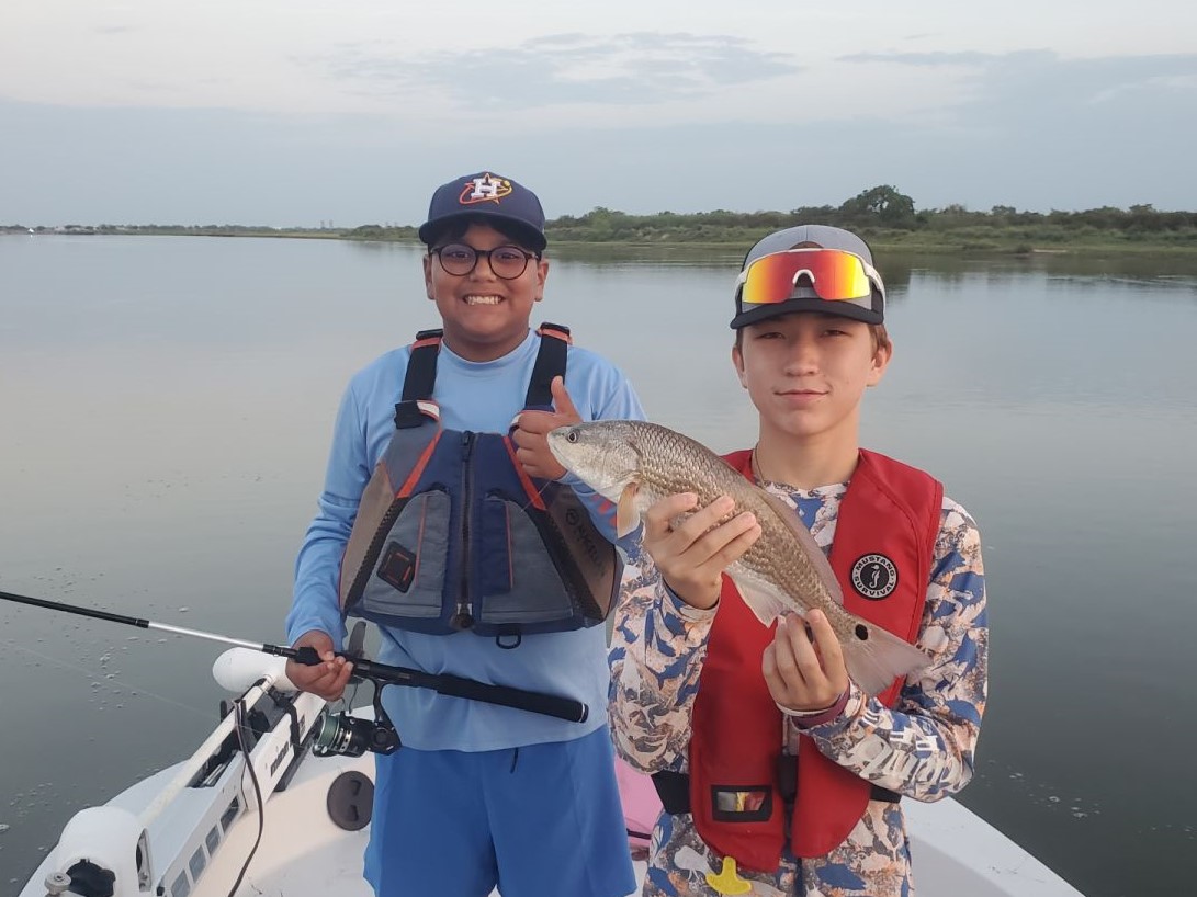 Angler with a redfish catch in Rockport