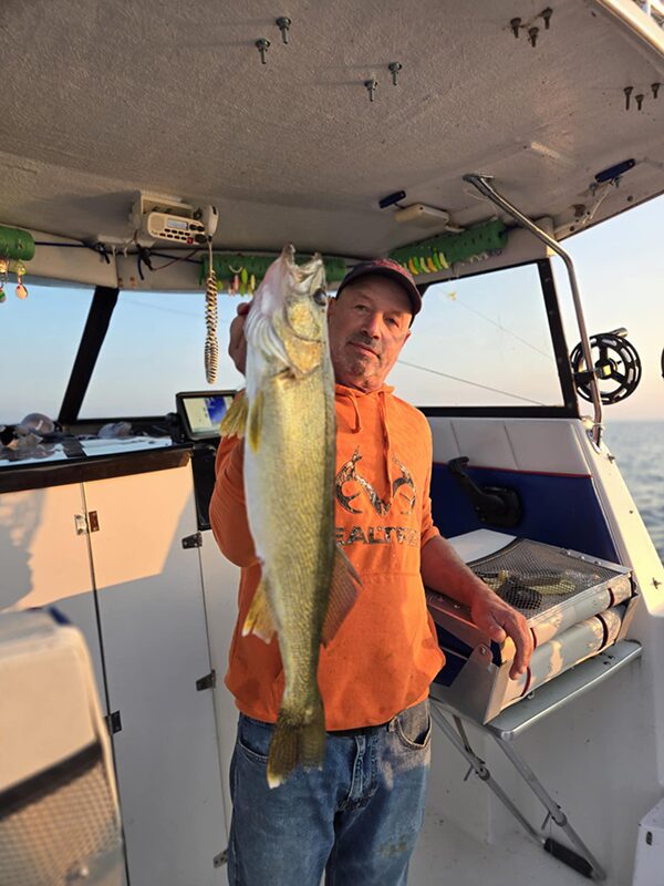 Walleye fishing success on Lake Erie near Erie PA with freshly caught fish displayed on boat