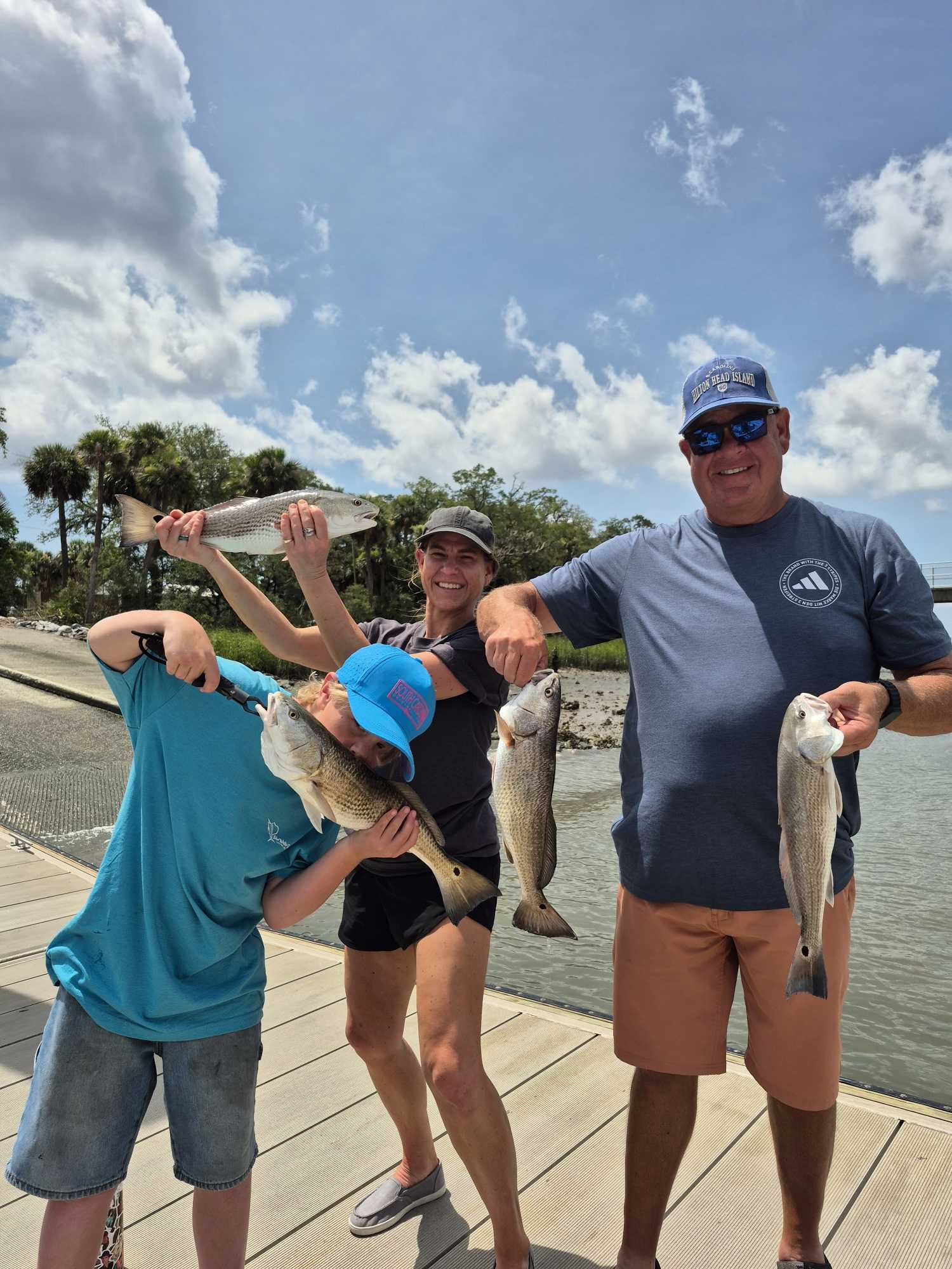 Successful redfish catch on Hilton Head Island SC fishing trip with multiple fish displayed