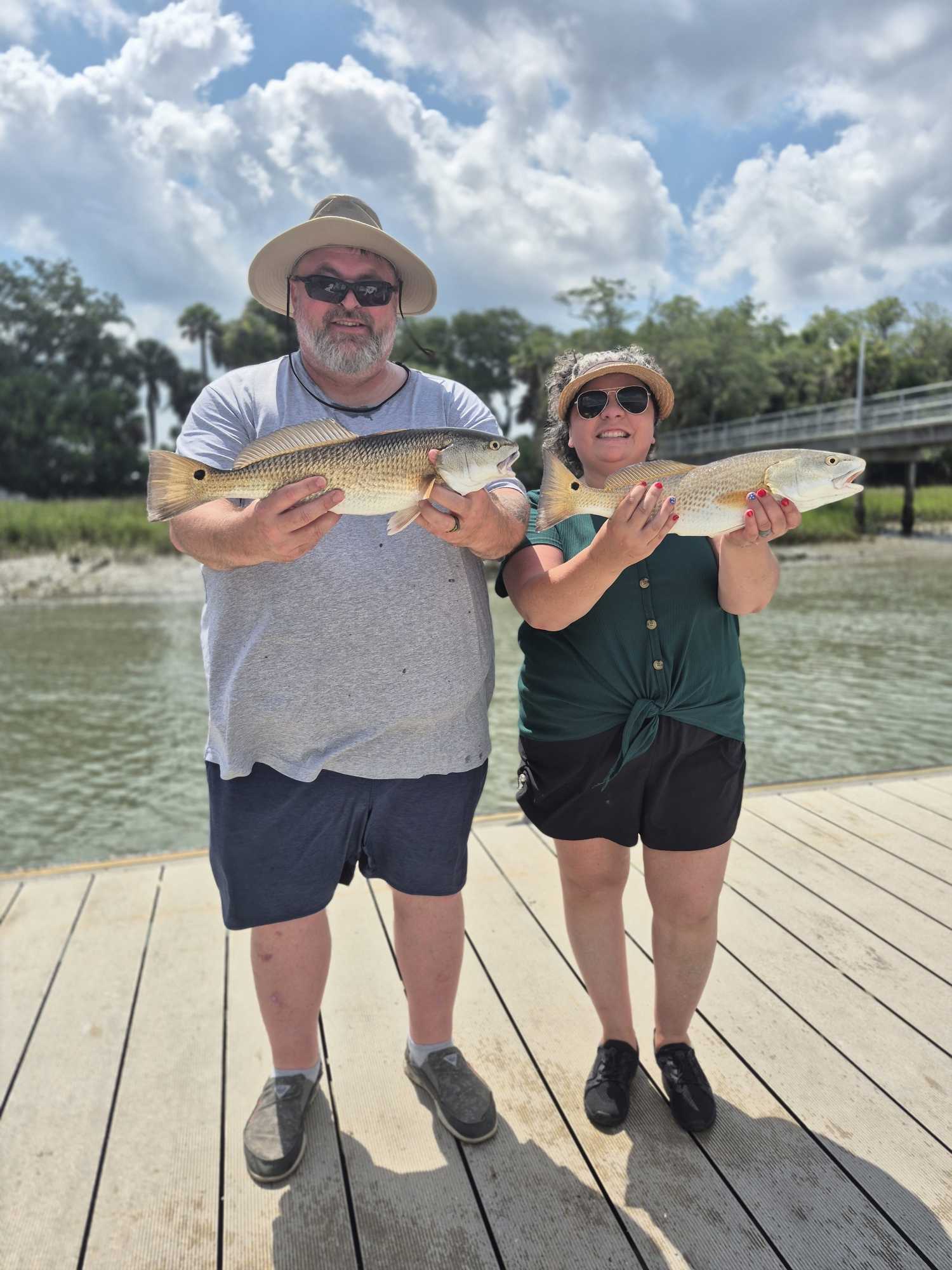 Two redfish caught fishing on Hilton Head Island SC displayed on wooden dock