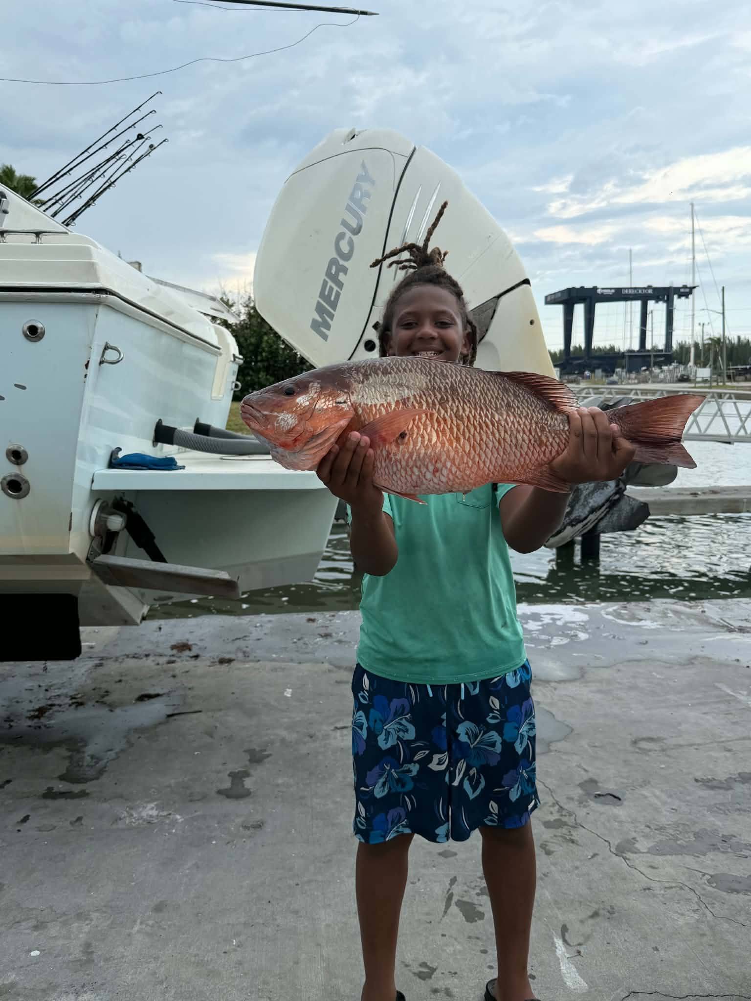 Large red snapper caught while fishing in Fort Pierce FL displayed at marina dock