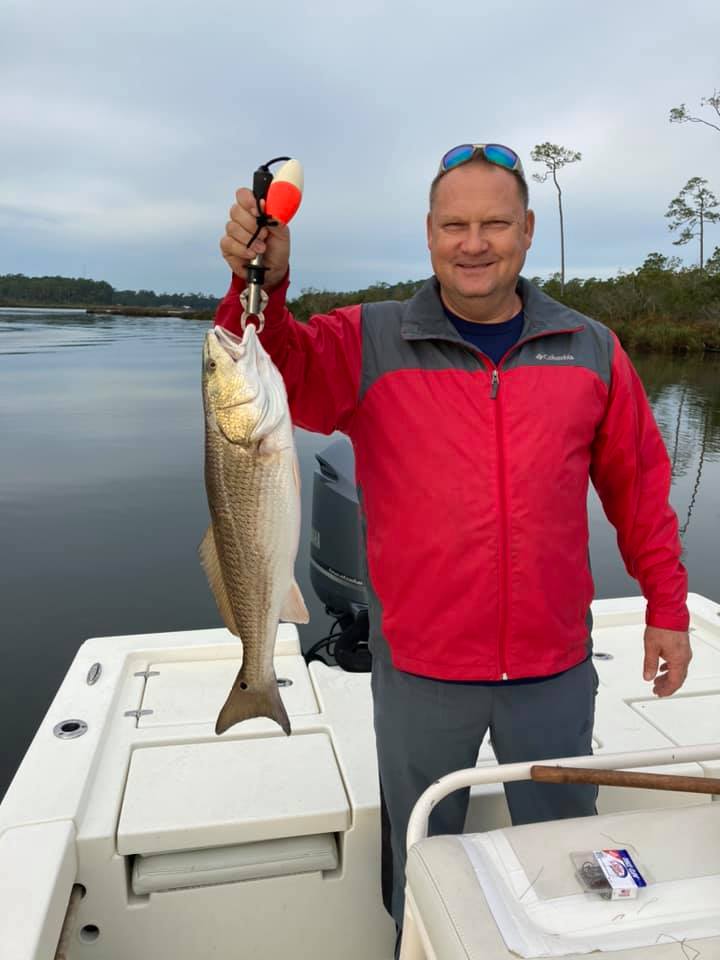 Angler with a 19-inch redfish caught in AL