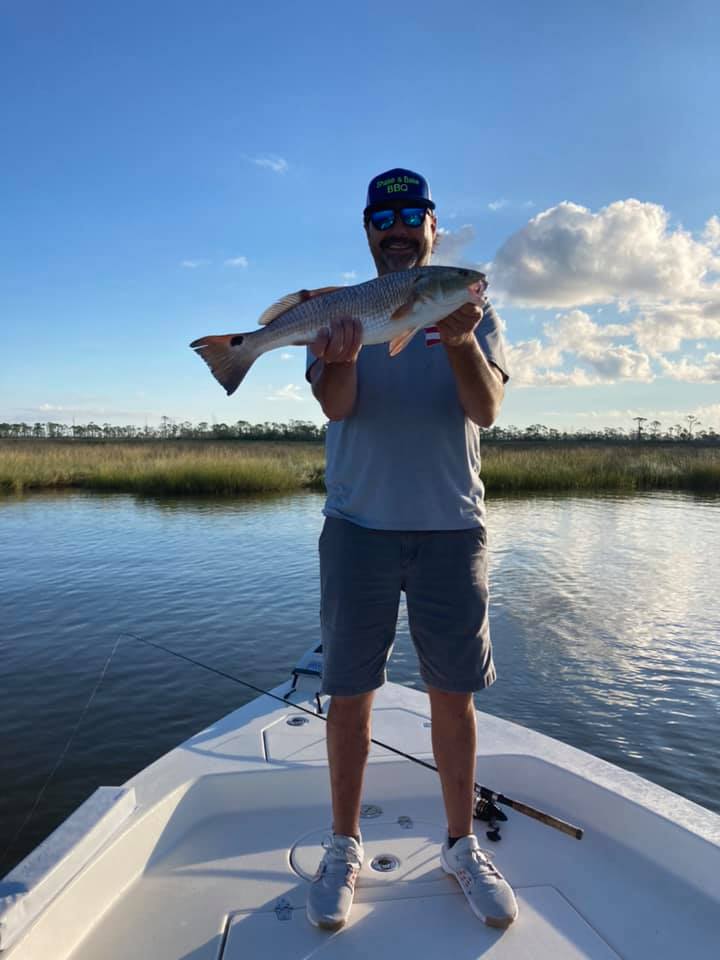 Angler holding a 19-inch fish in AL