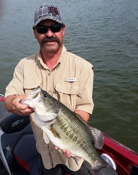 Bass fishing guide with guests on Lake Fork Texas from modern Nitro boat during morning trip