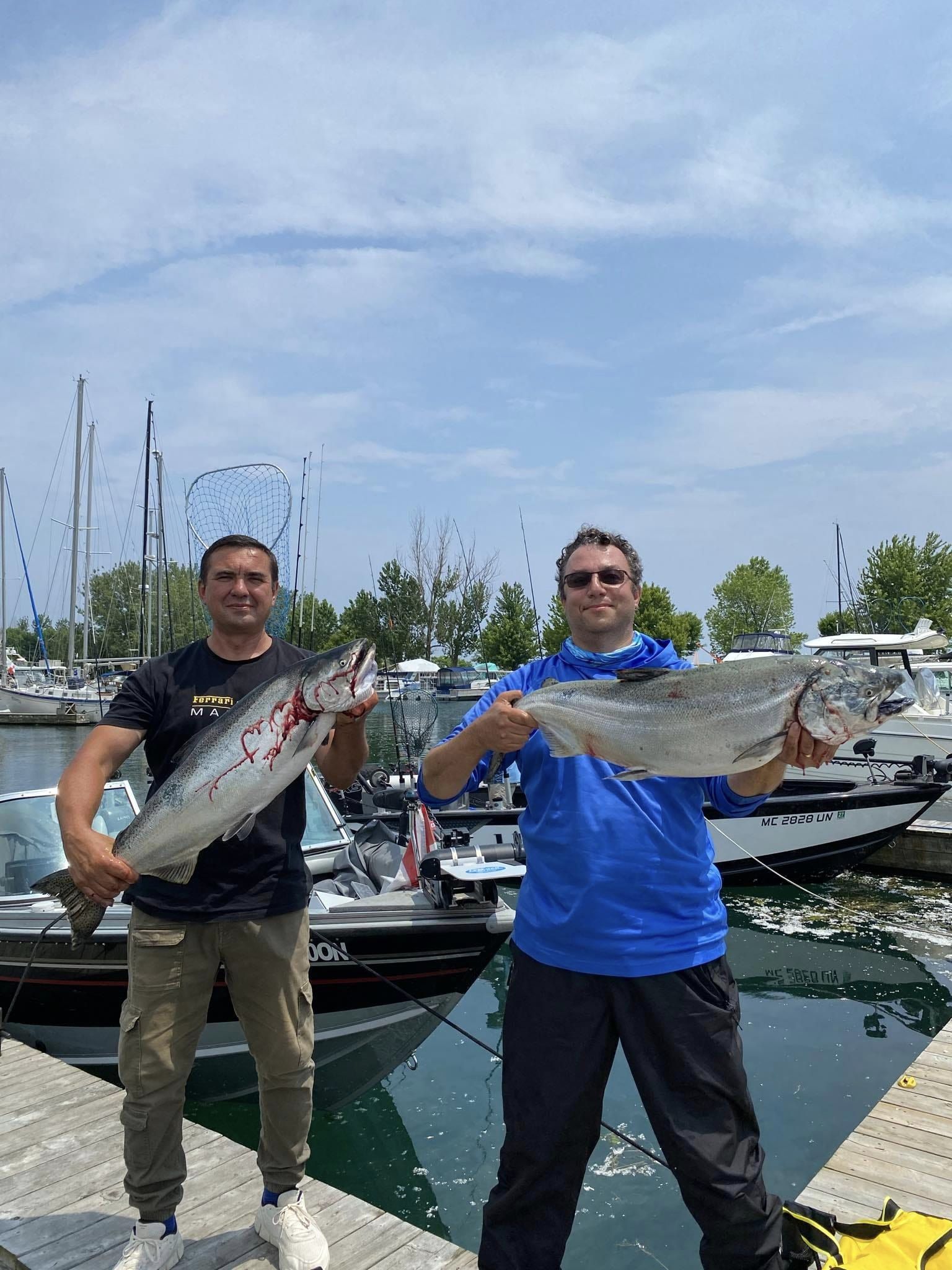 Two anglers with big fish in Toronto
