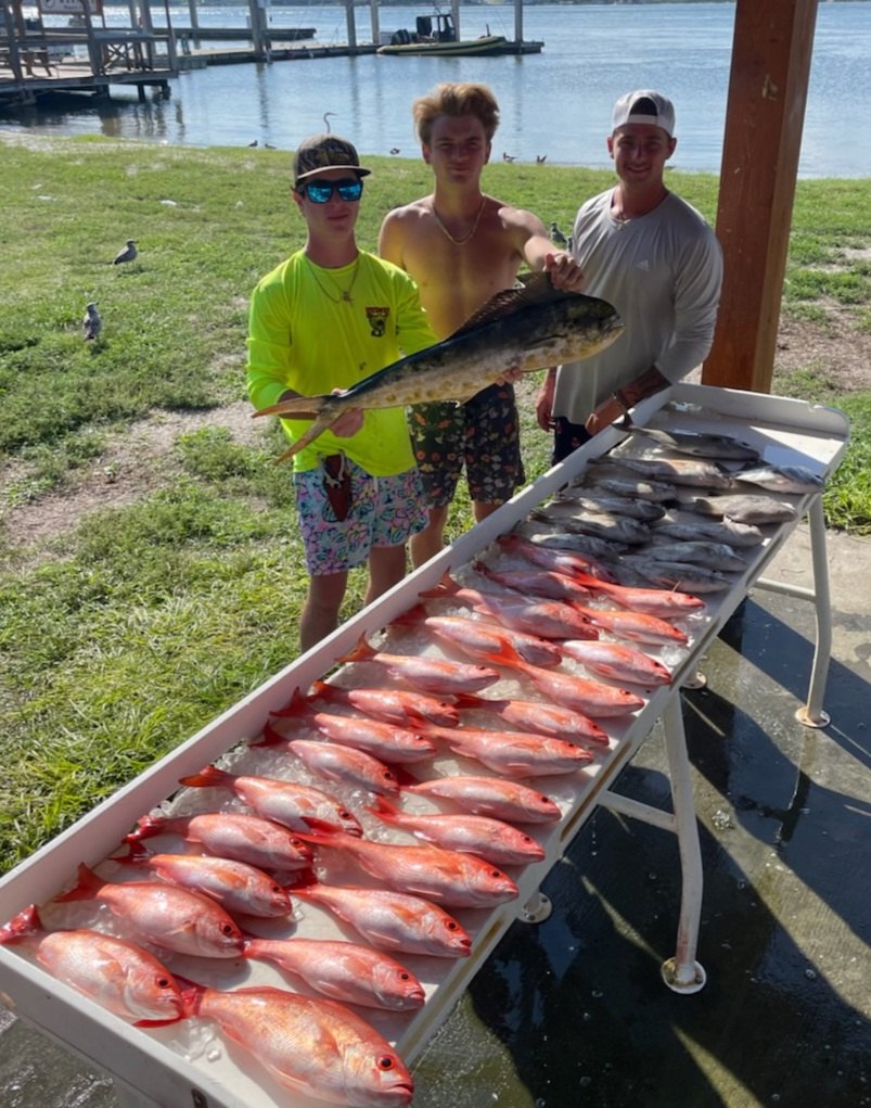 3 people fishing in Jacksonville with 2 big fish