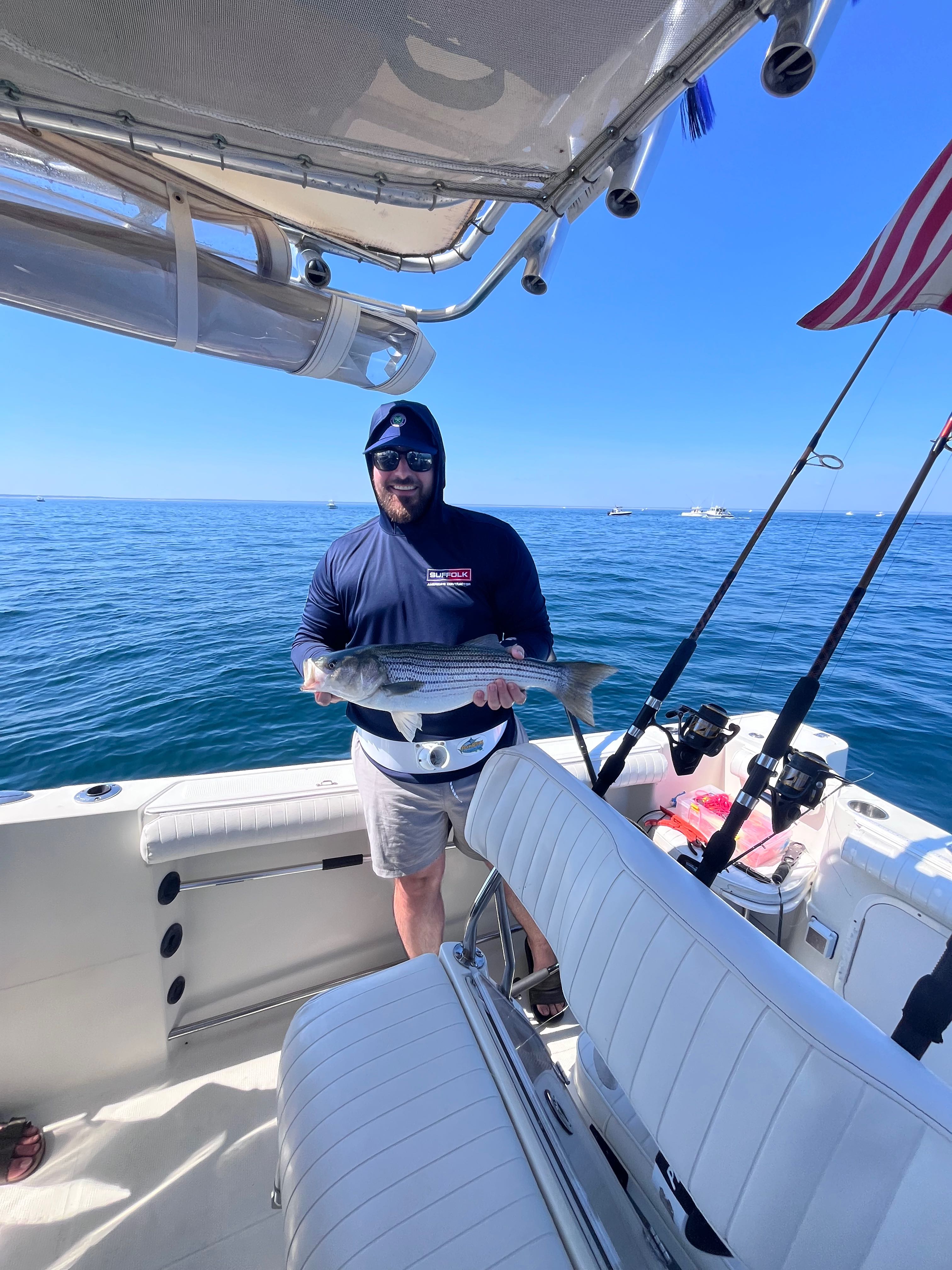 Striped bass caught during fishing tour in East Dennis MA on boat