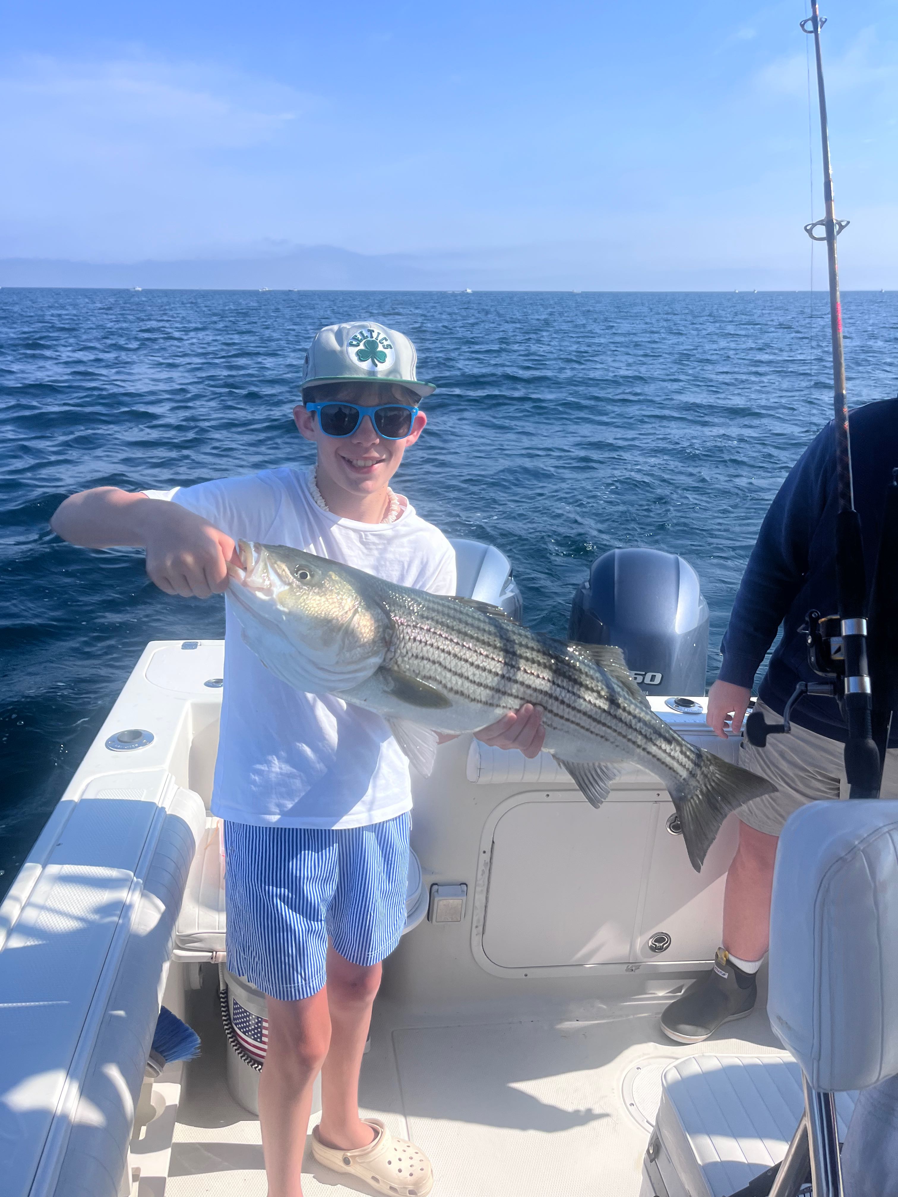 Striped bass fishing catch on boat in East Dennis MA waters