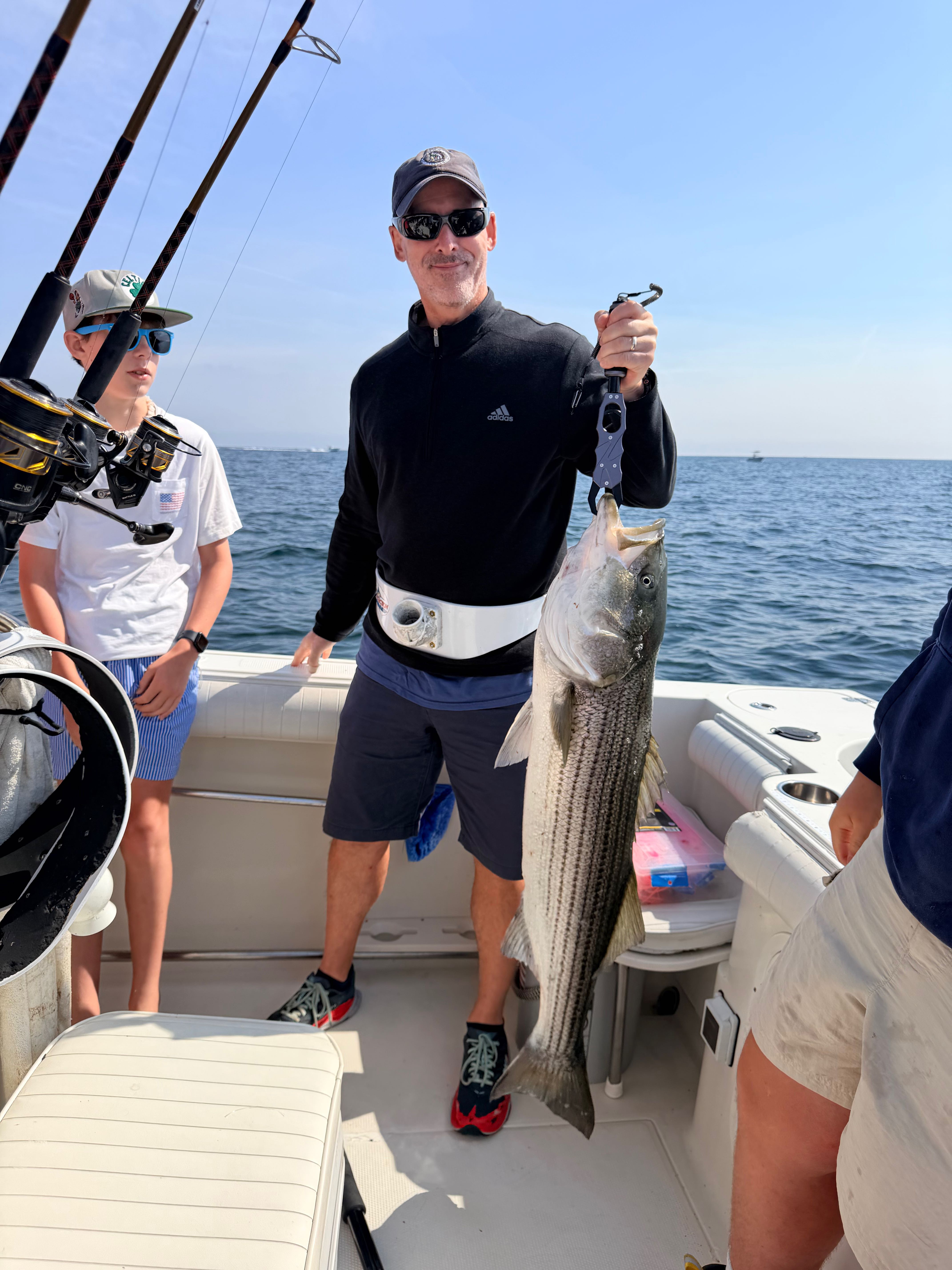 Striped bass catch on fishing charter boat in East Dennis MA waters