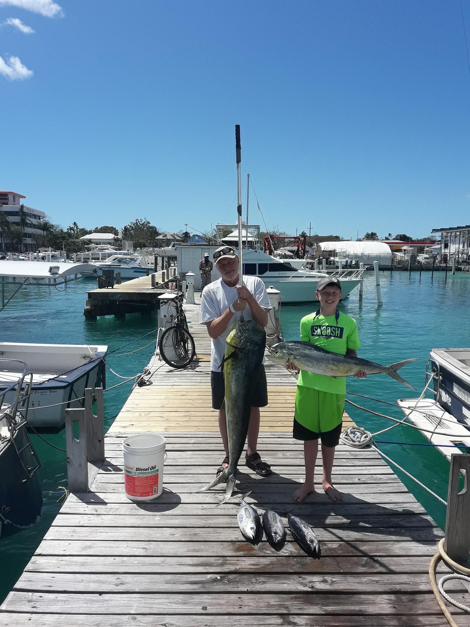 Two anglers fishing in the waters of Nassau