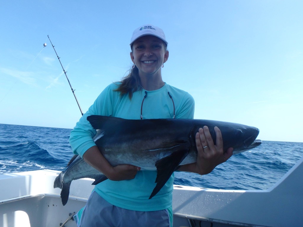 Angler with a fishing rod caught a 24-inch fish in Eastpoint