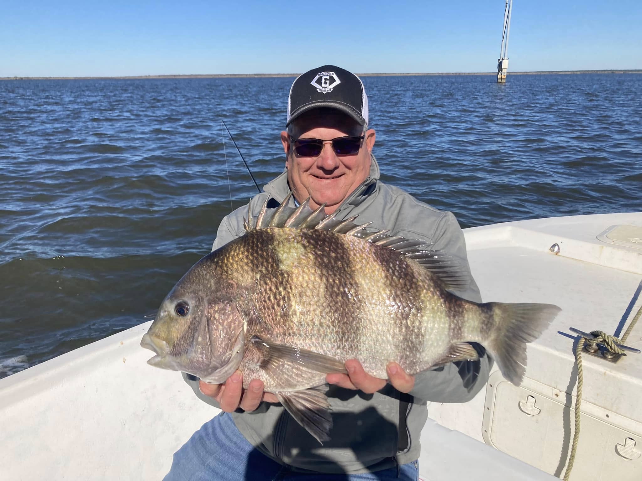 A person fishing for a sheepshead in Apalachicola
