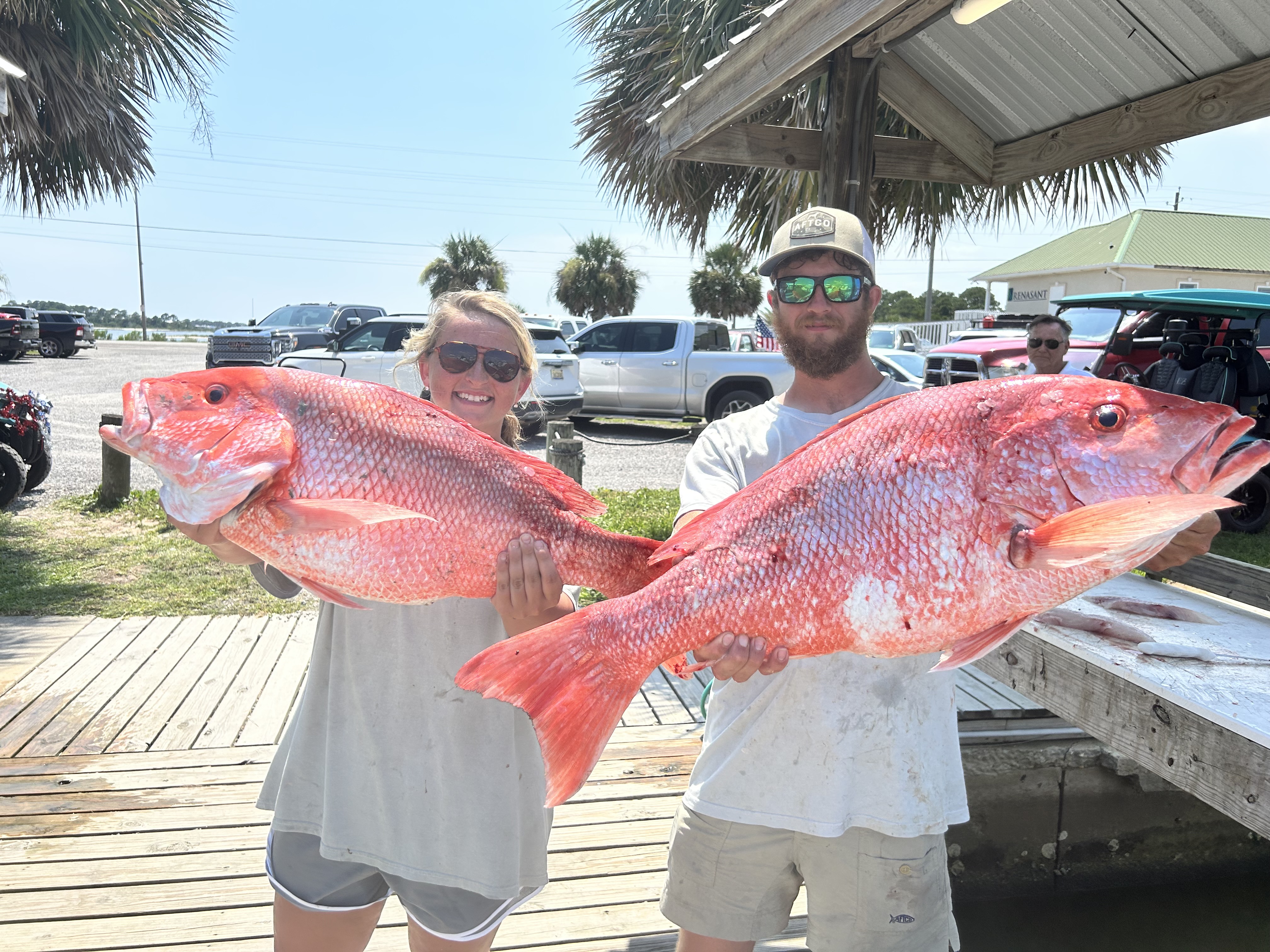 Three people fishing on Dauphin Island