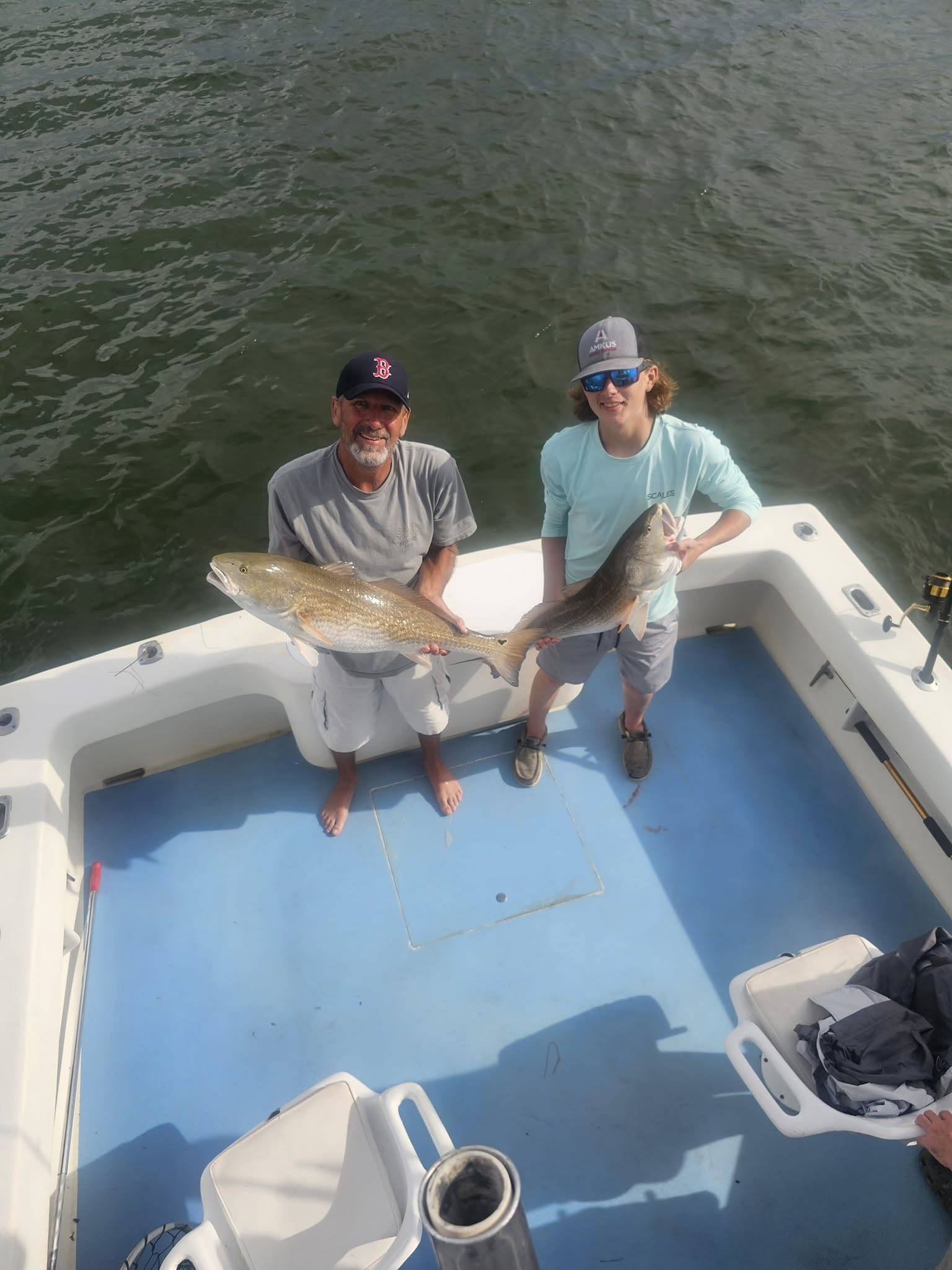 A pair of anglers with a large 25-inch fish in North Carolina