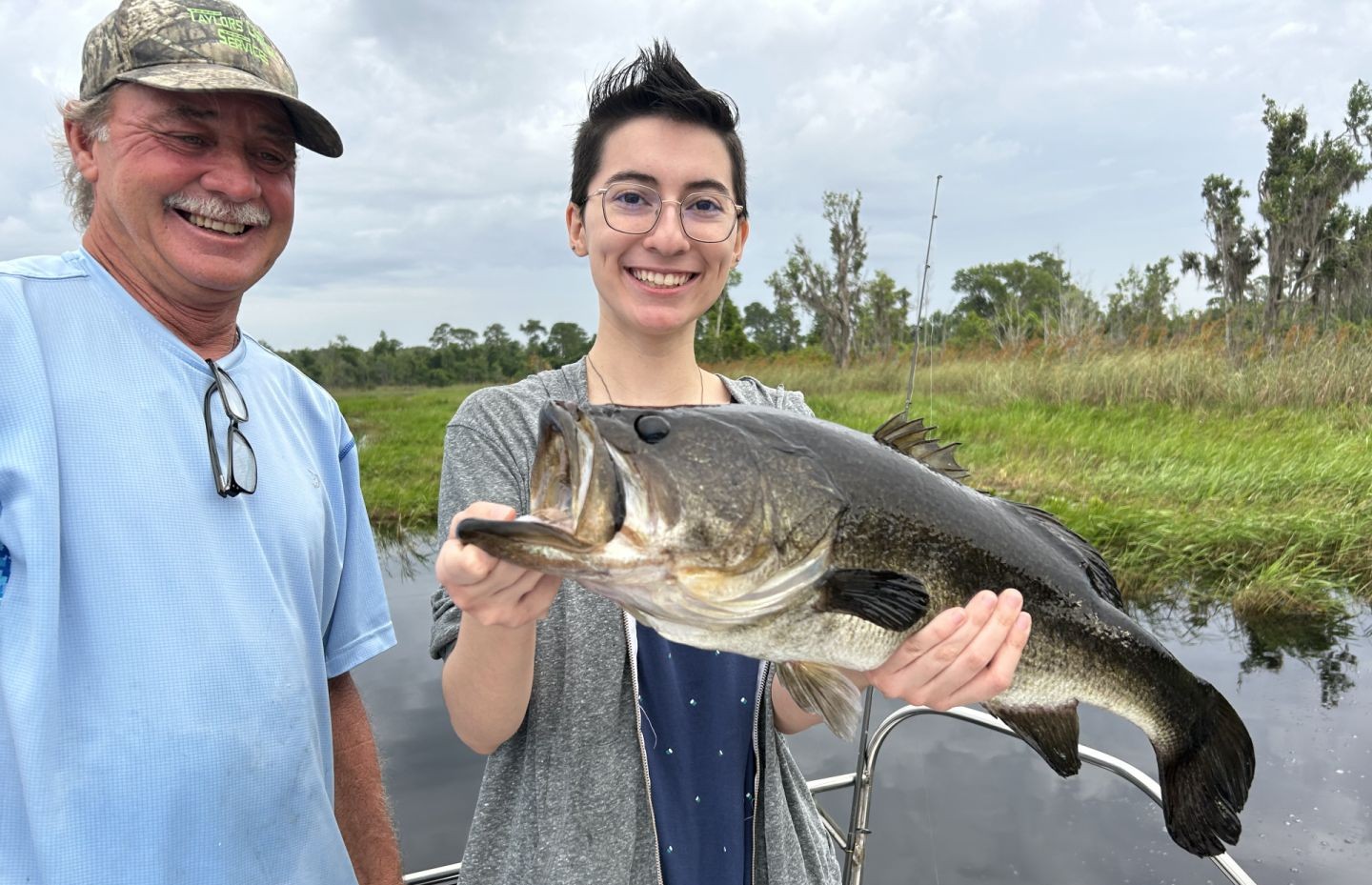 Two people fishing with fishing gear in Ocklawaha
