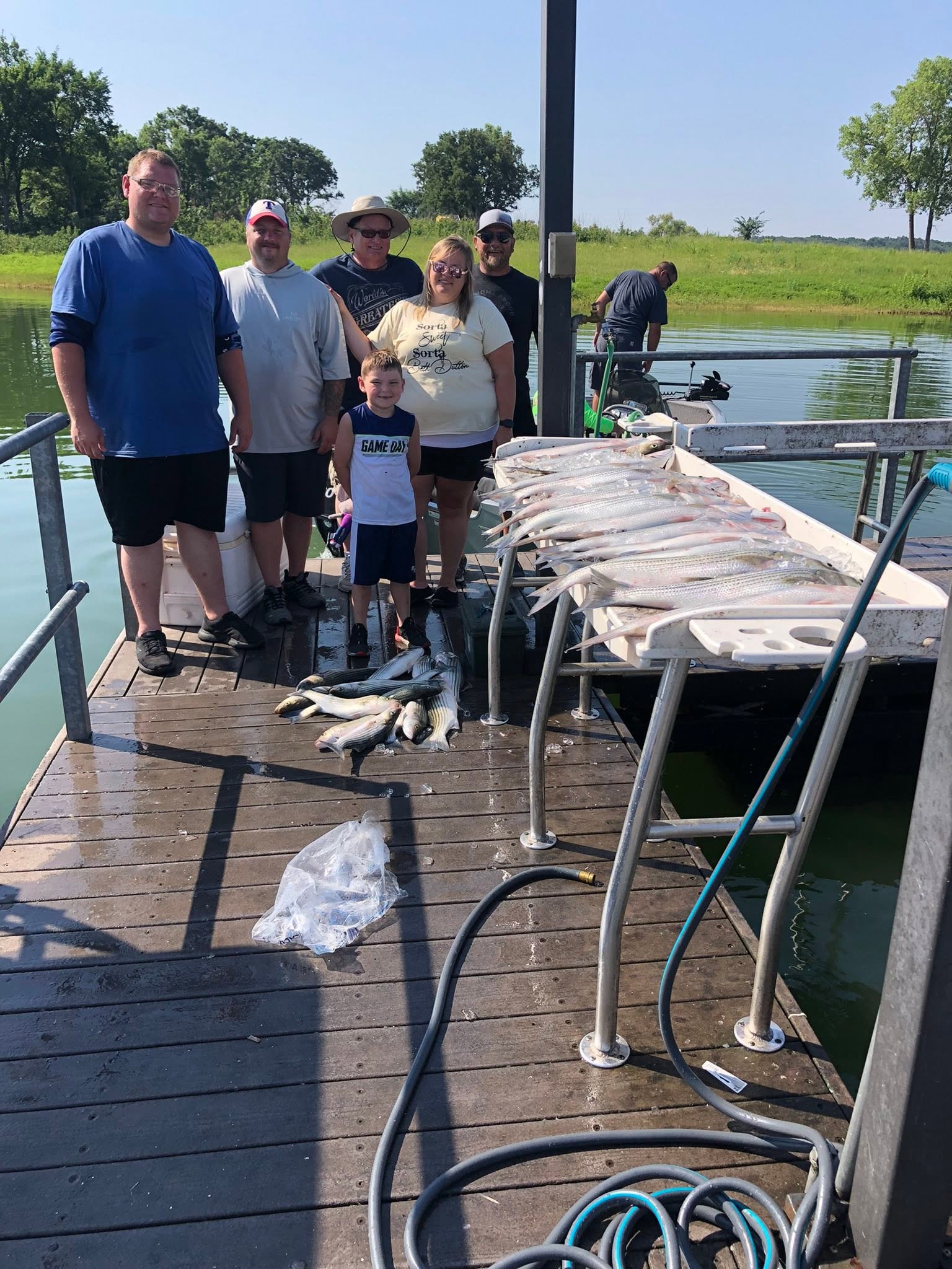 Successful fishing trip at Kingston OK with large catch of fish displayed on dock