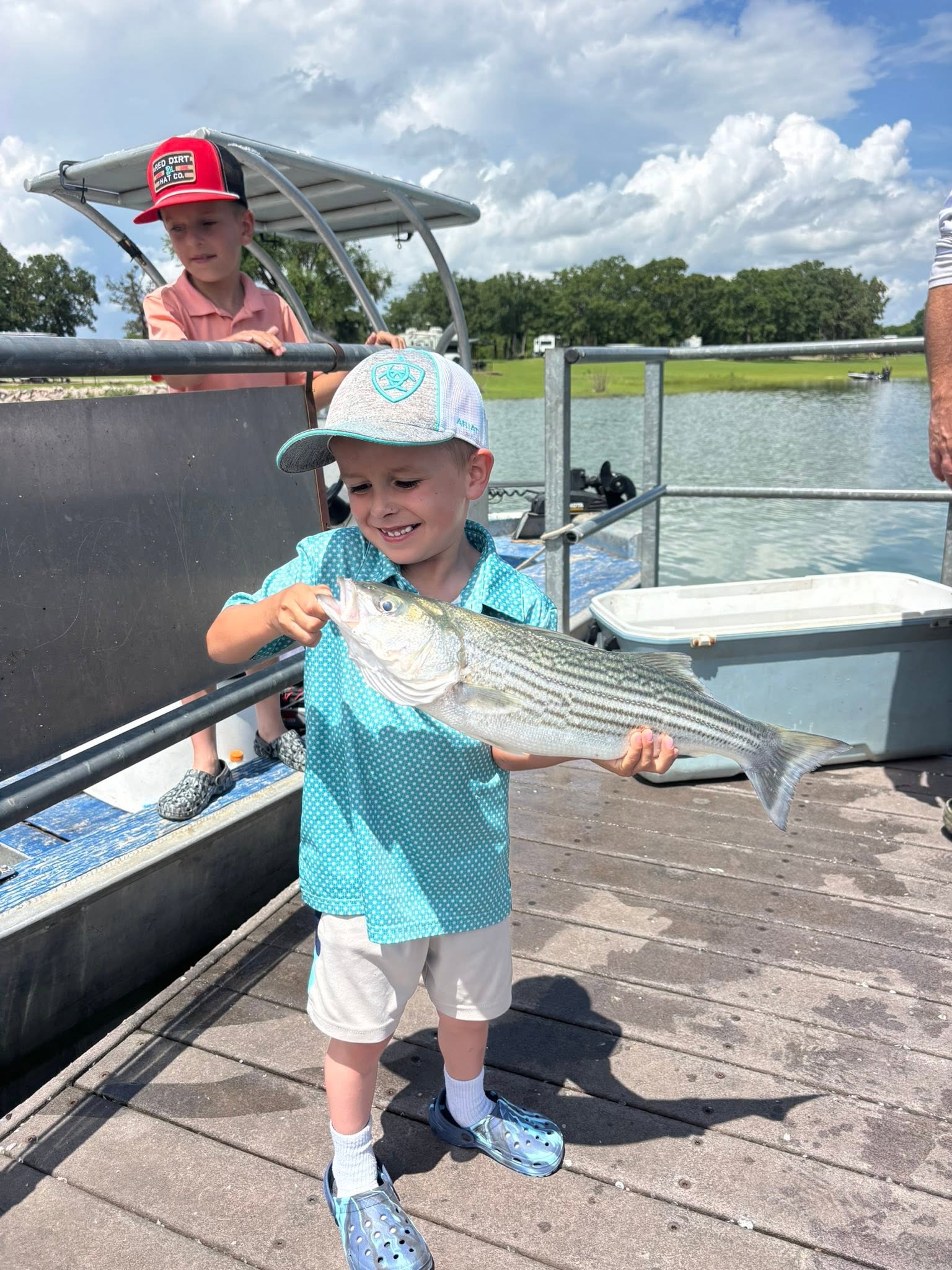 Fresh striped bass catch displayed on fishing dock in Kingston OK